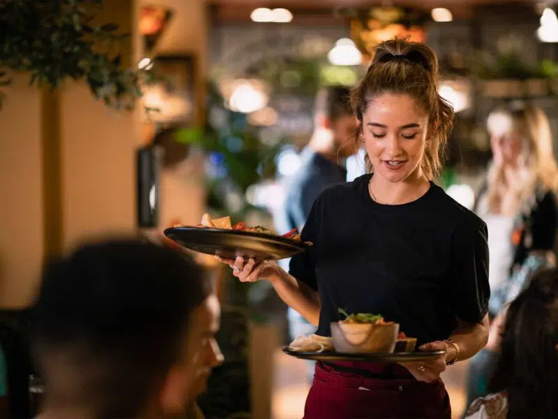 waitress serving customers at a restaurant