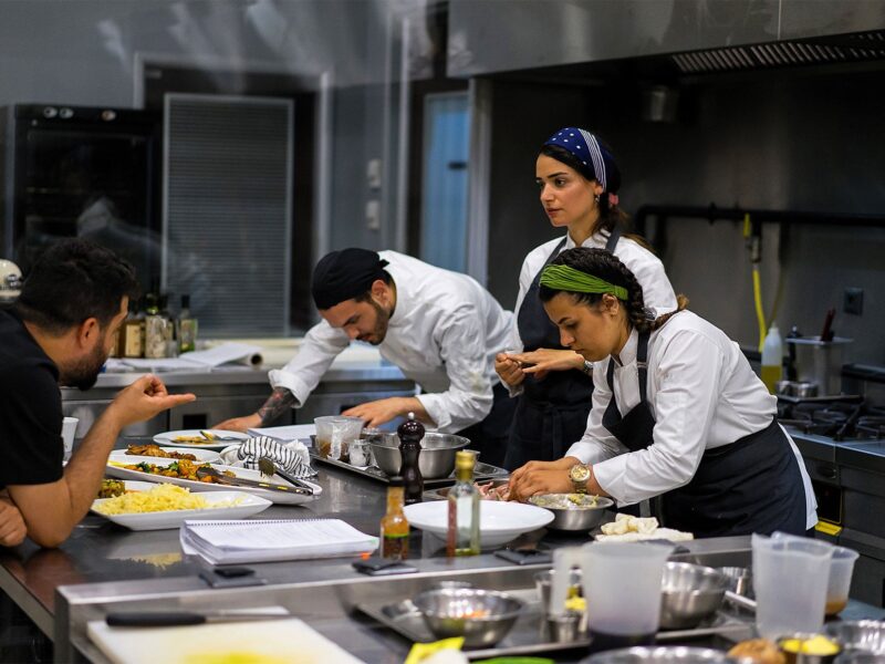 restaurant employees preparing food back of house