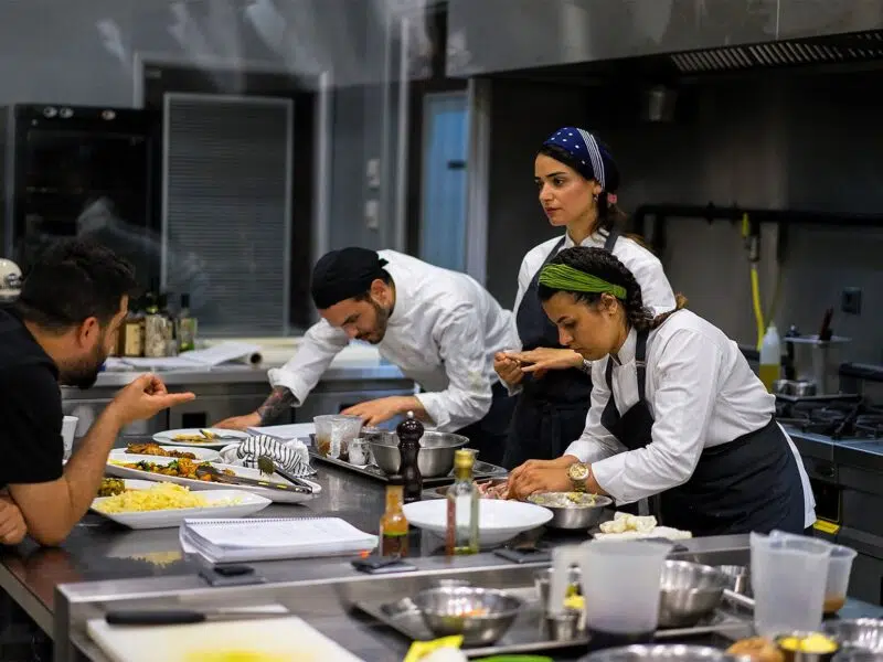 restaurant employees preparing food back of house