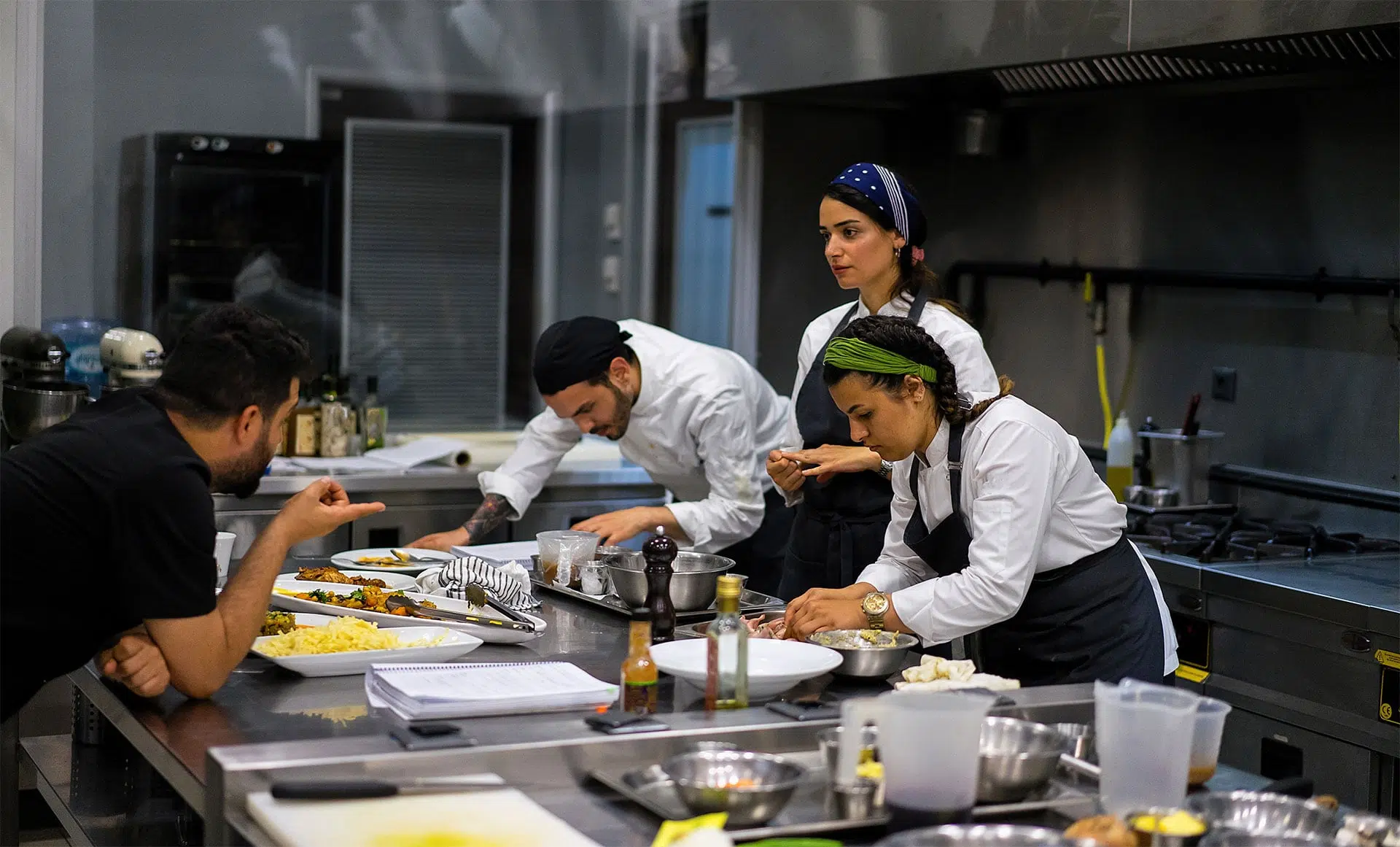 restaurant employees preparing food back of house