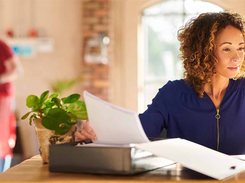 comparing paperwork with computer software