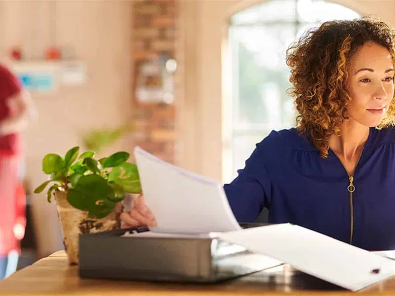 comparing paperwork with computer software