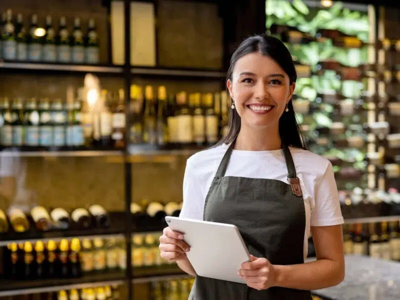 wine hostess holding tablet