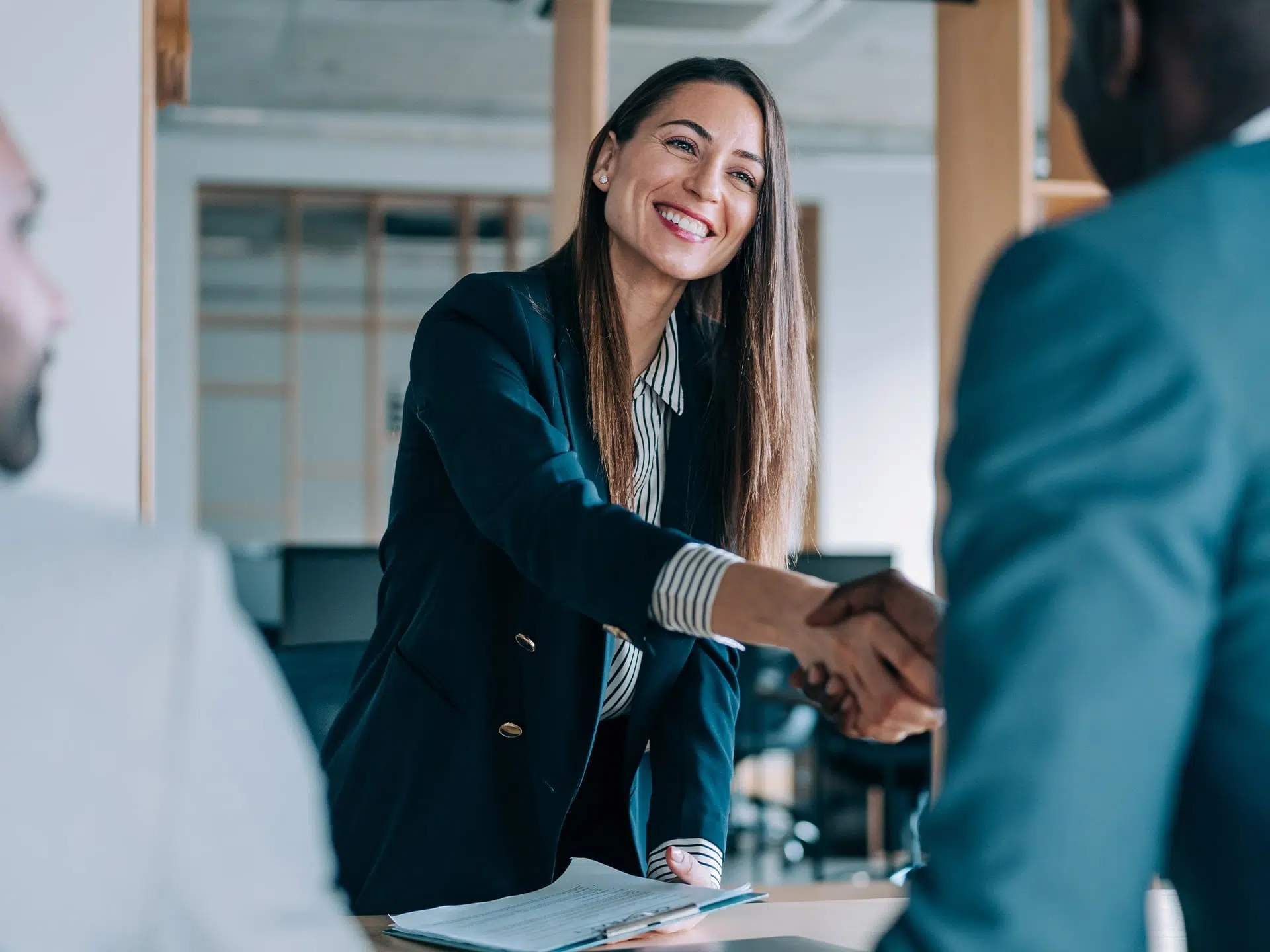 hotel concierge shaking hands with a customer