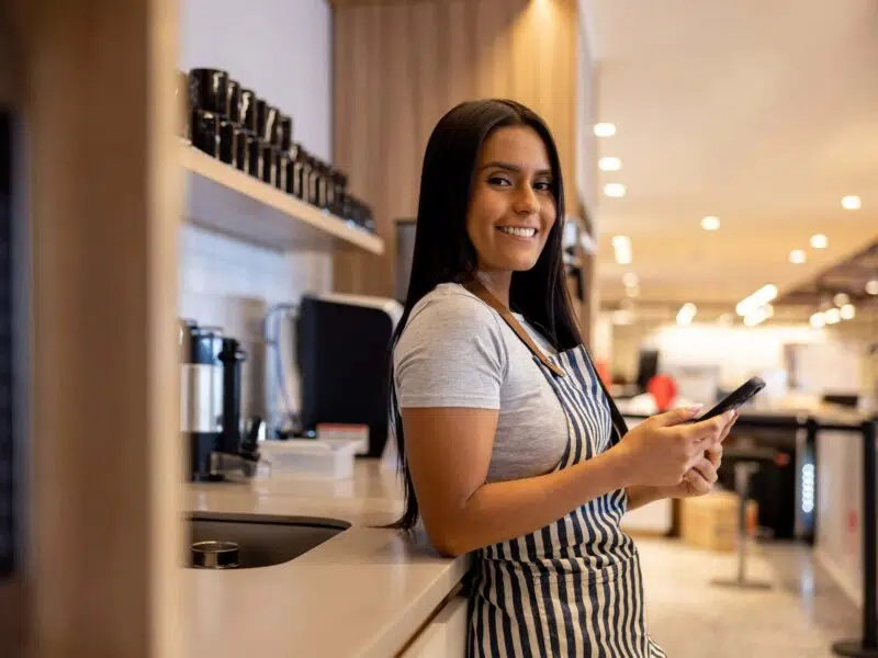 Smiling server in restaurant.