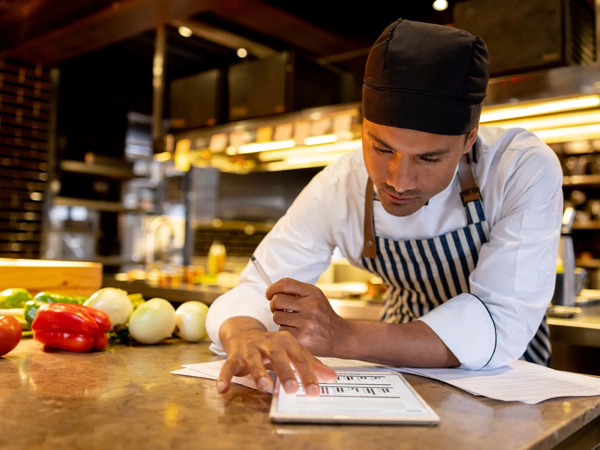 restaurant worker reviewing costs