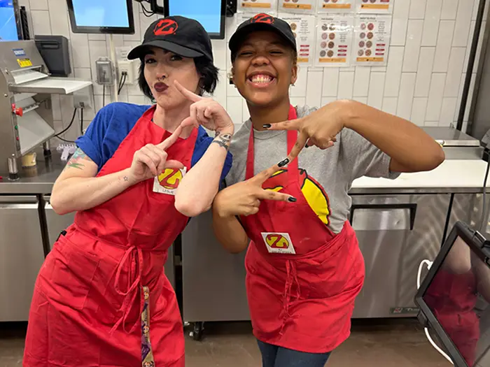 two people in the Zalat Pizza kitchen