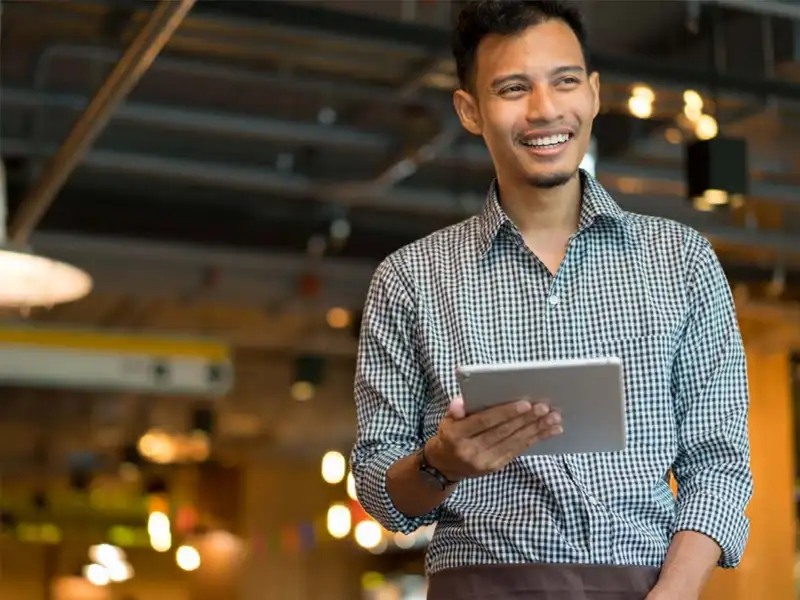 a restaurant manager with tablet