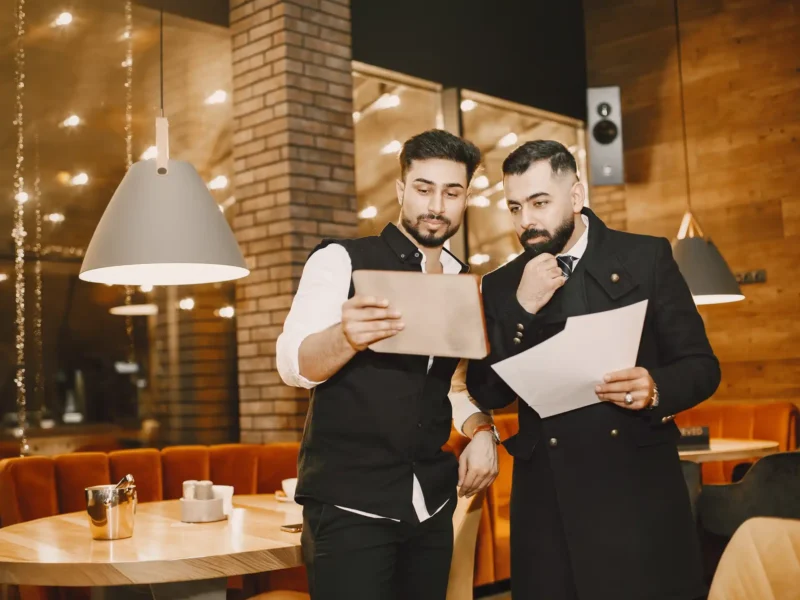 Restaurant managers looking over paperwork